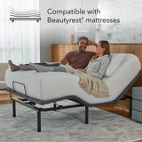 Couple relaxing on a adjustable bed in a bedroom setting, with text indicating compatibility with Beautyrest mattresses.