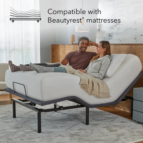 Couple relaxing on a adjustable bed in a bedroom setting, with text indicating compatibility with Beautyrest mattresses.